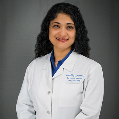 Dr. Jeena Leon Samuel DMD, BDS, FAGD, provides top-rated dental treatments at Smile Dental in Stafford, TX
